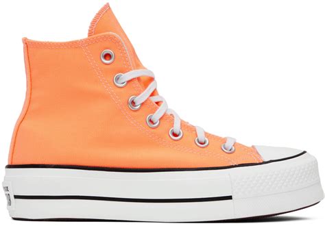 orange high top platform converse.